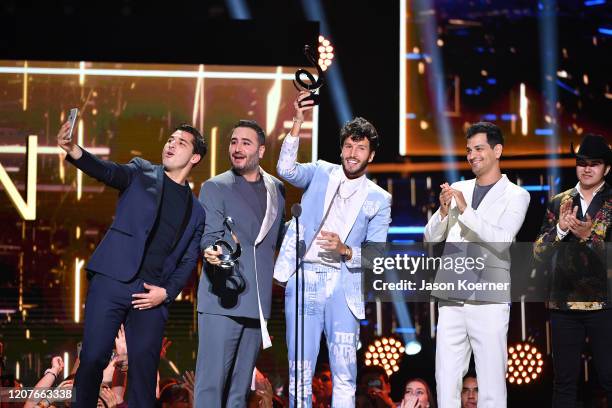 Julio Ramírez Eguía, Jesús Alberto Navarro Rosas, Sebastian Yatra and Gilberto Marín Espinoza accept an award on stage during Univision's Premio Lo...