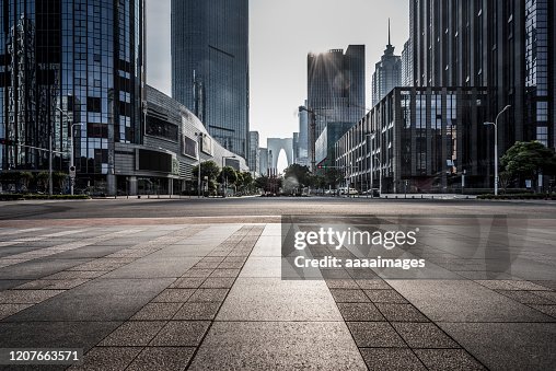 Empty pavement with modern architecture Empty pavement with modern architecture