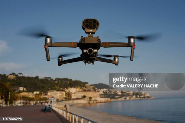 Picture shows a drone used by police officers to control people on the 'Promenade des Anglais' in the French Riviera city of Nice, on March 19 on the...