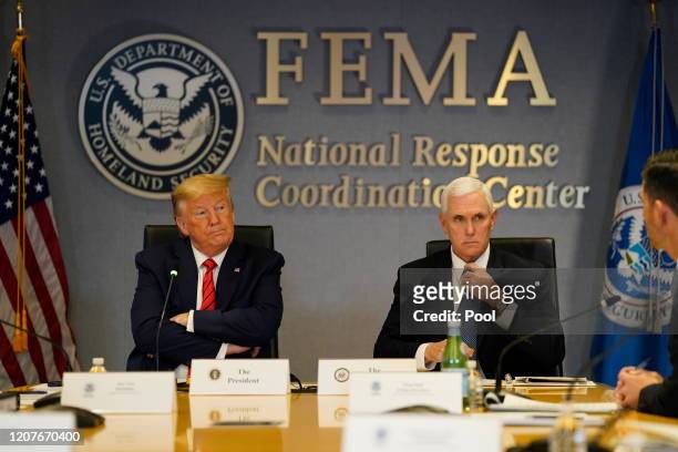 President Donald Trump and Vice President Mike Pence attend a teleconference with governors at the Federal Emergency Management Agency headquarters...