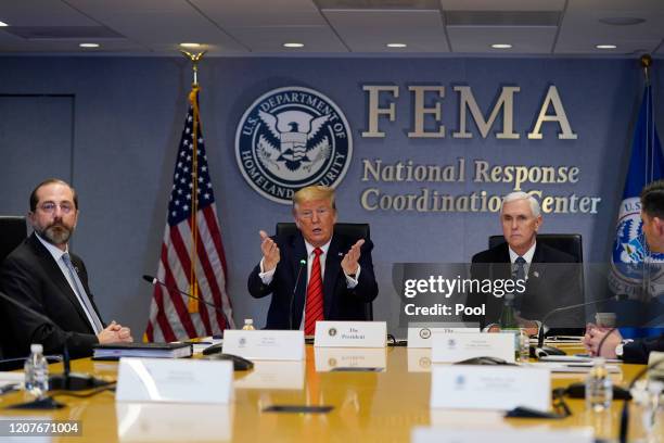 President Donald Trump speaks during a teleconference with governors at the Federal Emergency Management Agency headquarters, From left, Department...