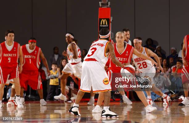 Bow Wow of the Clutch City handles the ball against Becky Hammon of the H-Town during the McDonald's NBA All-Star Celebrity Game at NBA Jam Session...