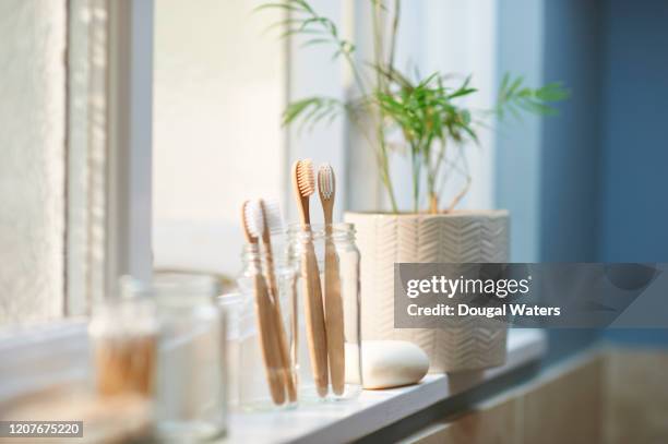 zero waste plastic free products on bathroom window sill. - bathroom routine stock pictures, royalty-free photos & images