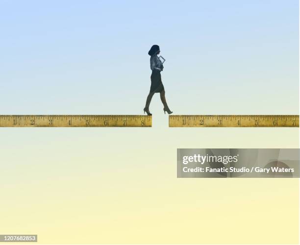 businesswoman walking over gap between two rulers - business woman movement dynamic stock illustrations