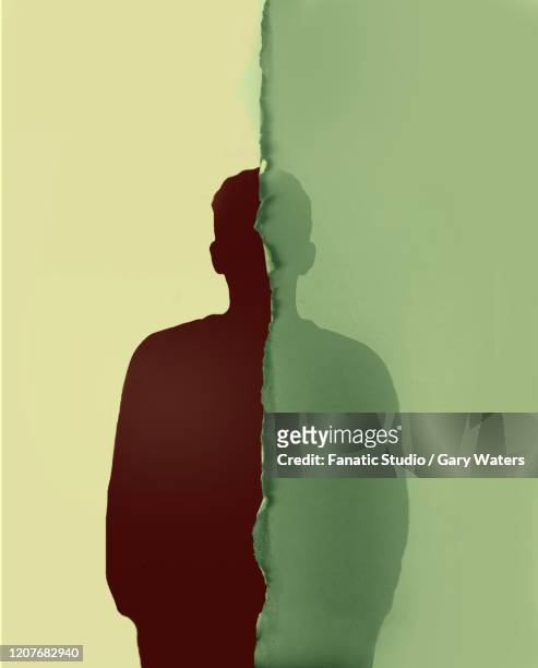 concept image of a silhouette of a man divided by a torn piece of paper. - 統合失調症点のイラスト素材／クリップアート素材／マンガ素材／アイコン素材