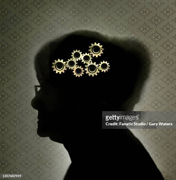 concept of an elderly woman with cogs in her head - senior women stock illustrations
