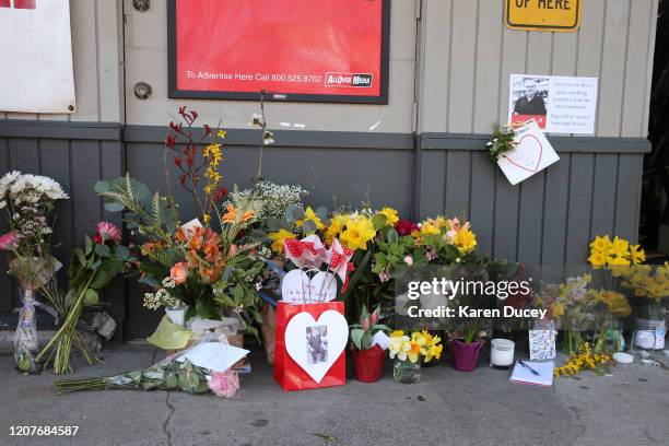 Flowers and messages are placed at a memorial for Steve Shulman, co-owner of the Leschi Market and active community member, outside the market on...