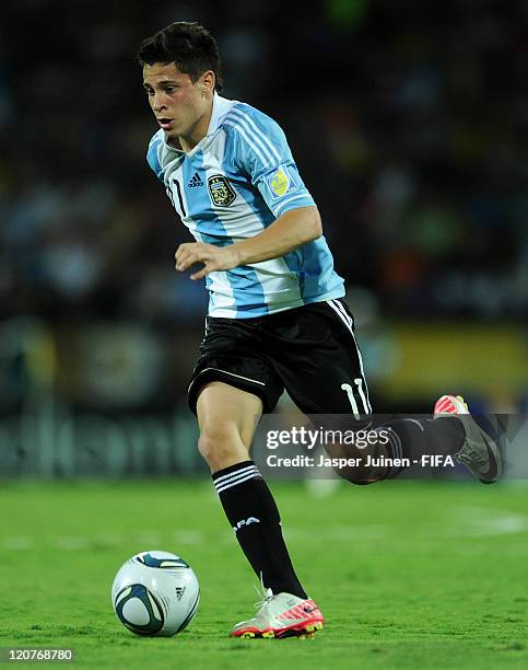 Juan Iturbe of Argentina runs with the ball during the FIFA U-20 World Cup Colombia 2011 round of 16 match between Argentina and Egypt at the...