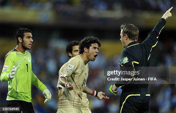 Goalkeeper Ahmed Elshenawi , Mohamed Ibrahim and Omar Gaber of Egypt disagree with a decision of referee Markus Strombergsson during the FIFA U-20...