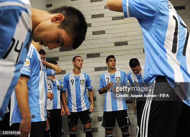 Facundo Ferreyra and Matias Laba of Argentina stand with their teammates in the tunnel prior to the FIFA U-20 World Cup Colombia 2011 round of 16...