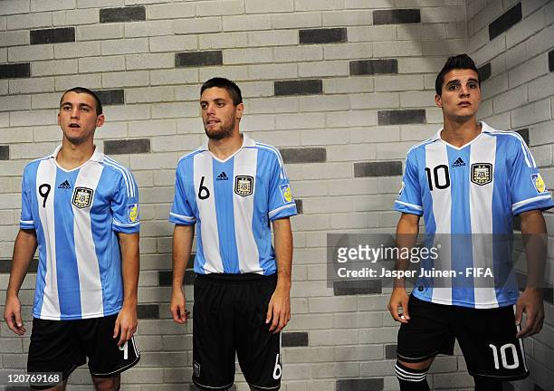 Facundo Ferreyra, Leonel Galeano and Erik Lamela of Argentina stand in the tunnel prior to the FIFA U-20 World Cup Colombia 2011 round of 16 match...