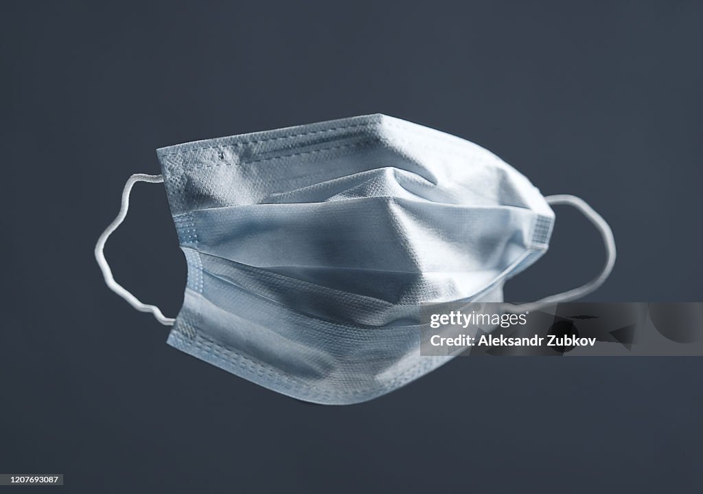 Medical Used Face Mask, Protects Against Virus. Concept Of Air Pollution, Pneumonia Outbreaks, Coronavirus Epidemics, And The Risk Of Biological Contamination.