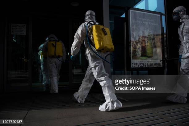 Members of the UME are seen inside the train station before disinfecting it. The UME has returned to Granada to disinfect some of the city's hot...