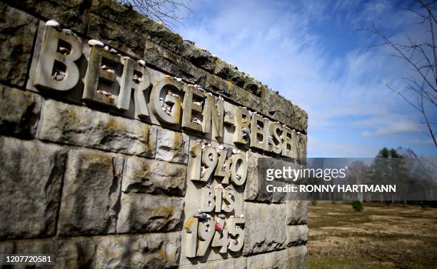 Pebble stones are placed on a wall at the entrance to the memorial site of the former Prisoner of War and concentration camp Bergen-Belsen, on March...