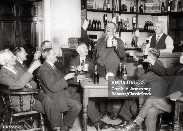 1930s nine men toasting at the beverly club a character who sat for the FW Elwell painting a man with a pint.