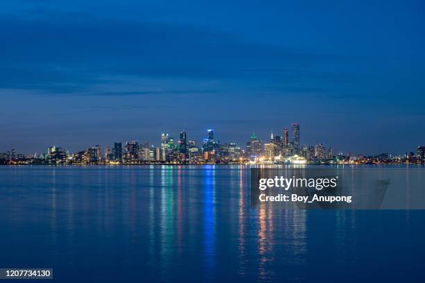 melbourne cityscape at night view from williamstown beach a suburb of melbourne, australia. - wide stock pictures, royalty-free photos & images