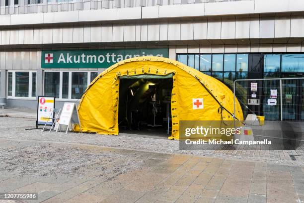 Tent is placed outside of the emergency room entrance to Danderyd hospital in order to screen patients for Covid-19 on March 20, 2020 in Stockholm,...