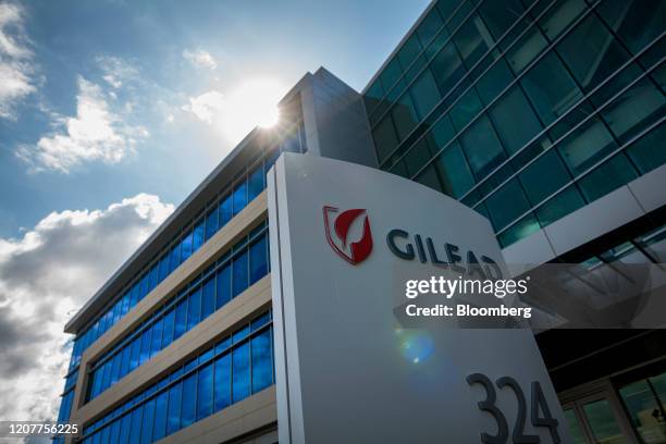 Signage is displayed outside Gilead Sciences Inc. Headquarters in in Foster City, California, U.S., on Thursday, March 19, 2020. Gilead Sciences...