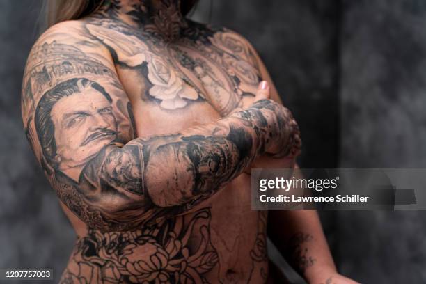 Portrait of tattoo artist Jessa Bigelow as she shows the tattoos on... News  Photo - Getty Images