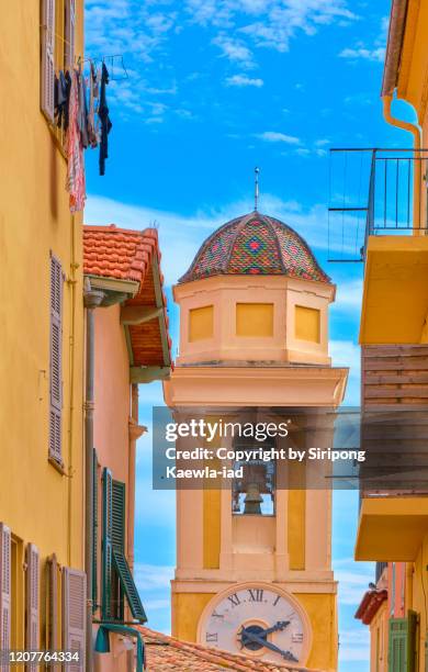 the clock tower of the old town in villefranche-sur-mer, provence-alpes-côte d'azur, france. - provence alpes cote dazur ストックフォトと画像