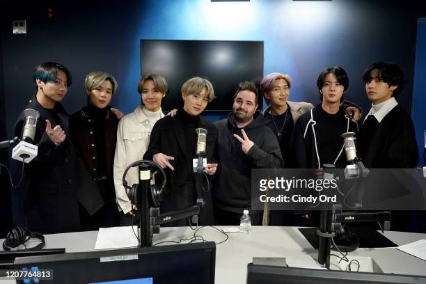 SiriusXM Host Mikey Piff poses with K-pop boy band BTS visit the SiriusXM Studios on February 21, 2020 in New York City.