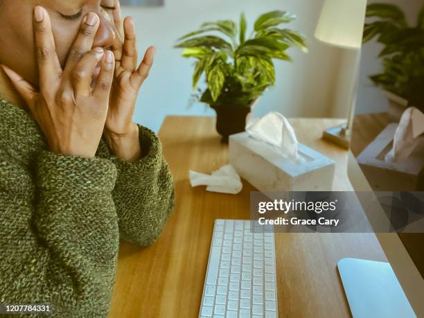 woman suffers sinus pain while working on desktop computer - cold keyboard stock pictures, royalty-free photos & images