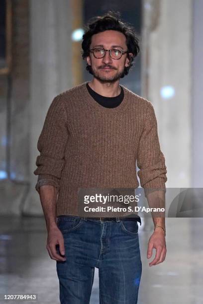 Fashion designer Marco De Vincenzo acknowledges the applause of the audience at the end of the Marco De Vincenzo fashion show as part of Milan...
