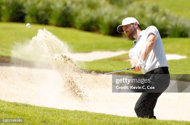 Kyle Stanley plays a shot from a bunker on the seventh hole during the second round of the Puerto Rico Open at Grand Reserve Country Club on February...