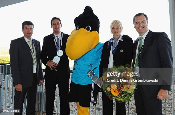 Referees Bibiana Steinhaus and Manuel Graefe receive the 'Referee of the Year 2011' award from Herbert Fandel , CEO of the German Referee Comission,...