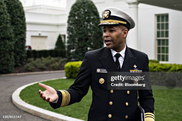 Vice Admiral Jerome Adams, U.S. Surgeon General, speaks to members of the media after a television interview outside of the West Wing of the White...