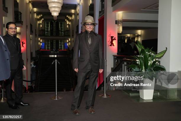 Johnny Depp poses next to Hiroyuki Sanada at the "Minamata" premiere during the 70th Berlinale International Film Festival Berlin at...