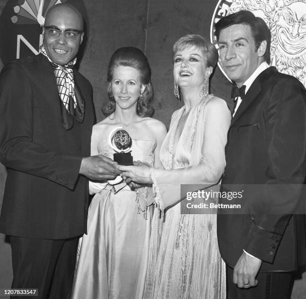 The four big winners in the annual Tony Awards pose for photographers after they took the major acting awards during the ceremony at the Mark...