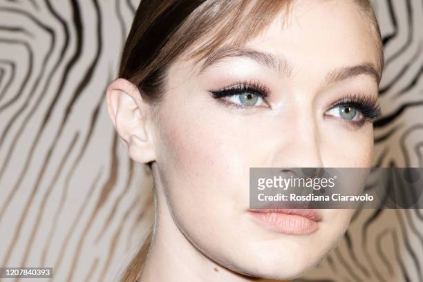 Top Model Gigi Hadid, make up detail is seen backstage at the Versace fashion show on February 21, 2020 in Milan, Italy.