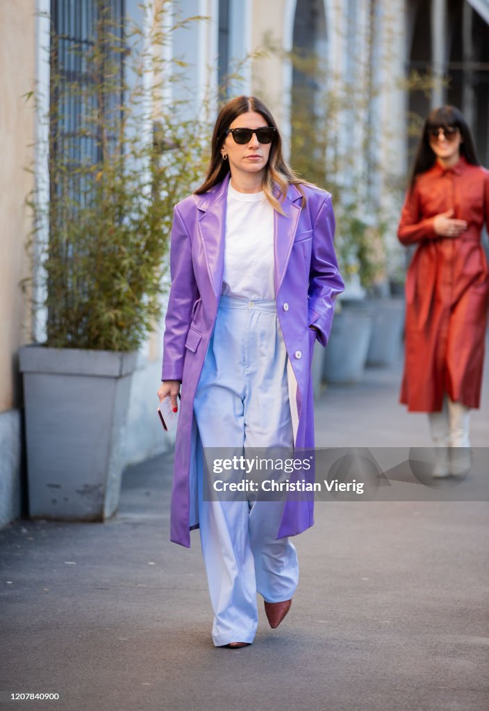A guest is seen wearing purple coat outside Tods during Milan Fashion ...