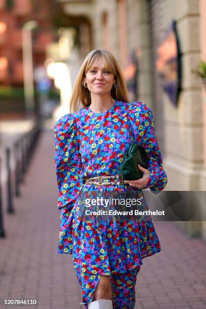 Jeanette Madsen wears a multicolor floral print dress, a green bag, outside Marni, during Milan Fashion Week Fall/Winter 2020-2021 on February 21,...