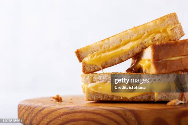 stack of grilled cheese sandwiches - cheddar cheese stock pictures, royalty-free photos & images