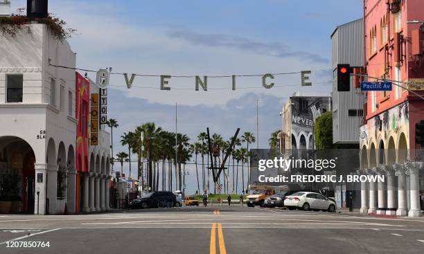 Quiet streets are seen around the Venice Sign near Venice Beach in Los Angeles on March 20 a day after Los Angeles County announced a near-lockdown,...