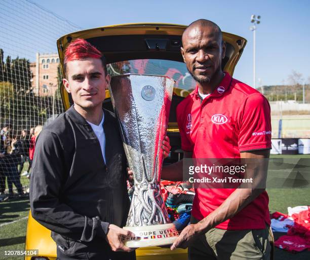 Delantero09 and Eric Abidal pose with the UEFA Europa League Trophy as part of the #PassThemOn campaign on February 21, 2020 in Barcelona, Spain. In...
