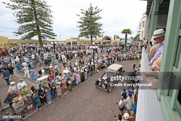 People line the streets to watch a vintage car parade on February 22, 2020 in Napier, New Zealand. The annual five day festival celebrates Napier's...