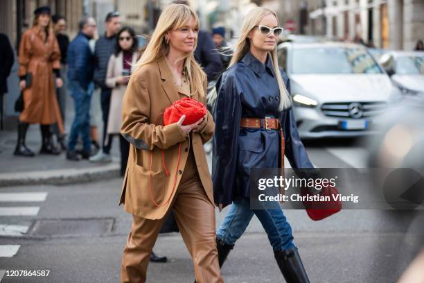 Jeanette Madsen wearing brown suit, red bag and Thora Valdimars wearing navy jacket, brown belt, two tone denim jeans is seen outside Sportmax during...