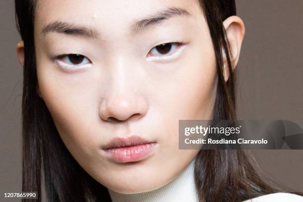 HyunJi Shin, make up detail is seen backstage at the Sportmax fashion show on February 21, 2020 in Milan, Italy.