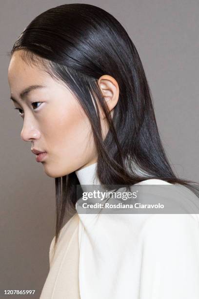 HyunJi Shin, hair detail is seen backstage at the Sportmax fashion show on February 21, 2020 in Milan, Italy.