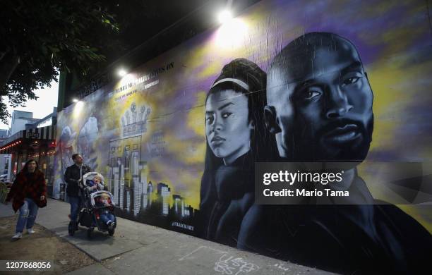 Mural depicting deceased NBA star Kobe Bryant and his daughter Gianna, painted by @hijackart, is displayed along a sidewalk on February 14, 2020 in...