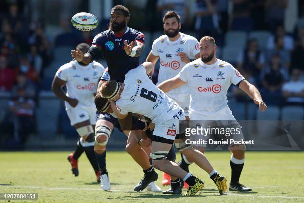 Marika Koroibete of the Rebels passes the ball during the round four Super Rugby match between the Rebels and the Sharks at Mars Stadium on February...