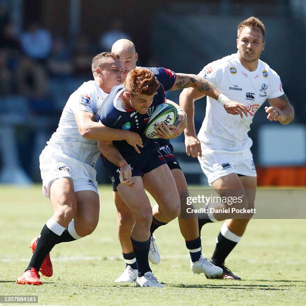 Andrew Kellaway of the Rebels is tackled during the round four Super Rugby match between the Rebels and the Sharks at Mars Stadium on February 22,...