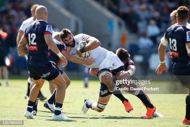 Andre Esterhuizen of the Sharks is tackled during the round four Super Rugby match between the Rebels and the Sharks at Mars Stadium on February 22,...