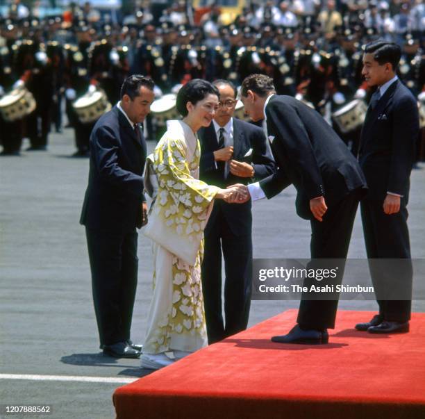 Crown Prince Akihito and Crown Princess Michiko are welcomed by Mexican President Adolfo Lopez Mateos at the welcome ceremony on arrival at the...