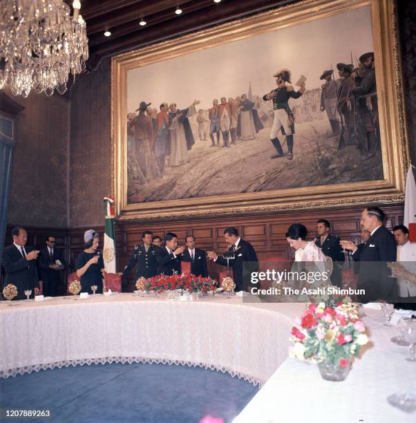 Crown Prince Akihito and Crown Princess Michiko toast glasses with Mexican President Adolfo Lopez Mateos during their luncheon on May 12, 1964 in...