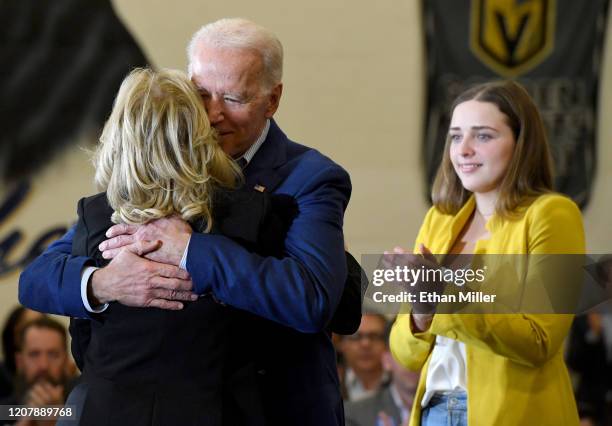 Dr. Jill Biden hugs her husband, Democratic presidential candidate former Vice President Joe Biden, as their granddaughter Finnegan Biden looks on...