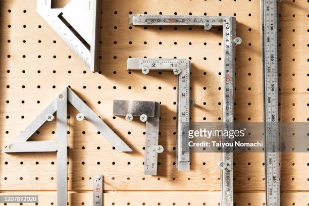 various types of rulers hung on the wall - unit of measurement stock pictures, royalty-free photos & images